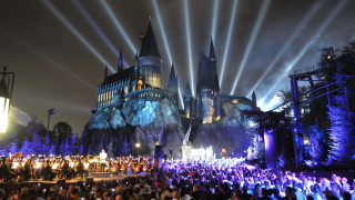 Crowd castle night lights stage - magical atmosphere free wallpaper