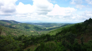 Valley trees hills clouds sky - a view of a valley free wallpaper for desktop