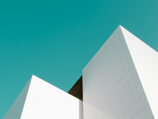 White building clock blue sky - sharp edge free wallpaper