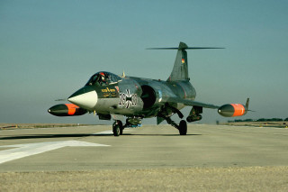 Fighter jet airport runway sky 2 - a sky background and a person free wallpaper