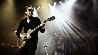 Man playing guitar stage lights - brad holland free wallpaper