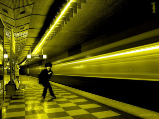 Man walking subway platform train - a yellow light free wallpaper