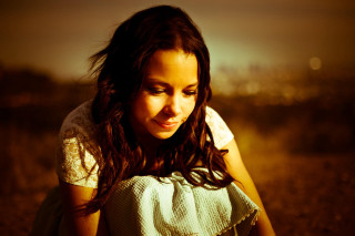 Girl sitting field cellphone city - her cell phone free wallpaper