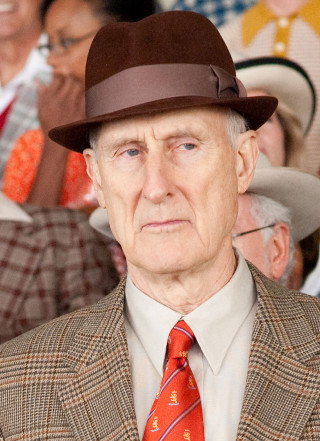 Older man brown hat red - scene free wallpaper for mobile