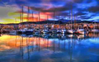 Harbor boats colorful sky clouds - a city in the distance free wallpaper