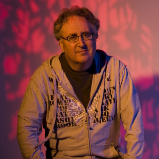 Man grey hoodie holding remote - michael kaluta free wallpaper