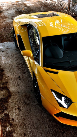 Yellow sports car dirt road 3 - free cars wallpaper for mobile