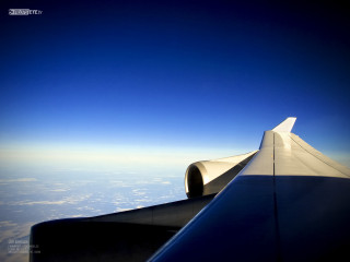 Plane wing view sky window - a plane in the sky free wallpaper