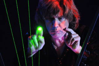 Man holding green light pointing - a man holding free wallpaper