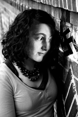 Woman brick wall black white - leaning free wallpaper for mobile