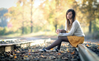Train track woman autumn blurry - a train track free wallpaper