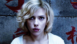 Surprised woman looking camera wall - movie still free wallpaper for desktop