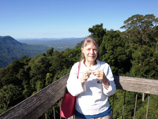 Woman wooden balcony mountains trees - bracha l. ettinger free wallpaper