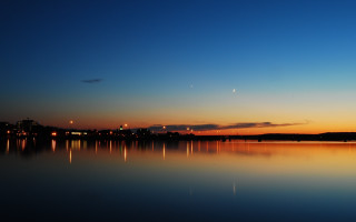 Lake city sunset plane lights - a city in the distance free wallpaper for desktop