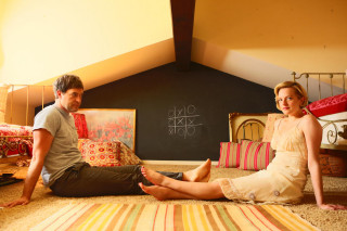 Man woman sitting bed chalkboard - the wall behind them free wallpaper