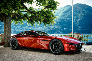 Red sports car hillside lake - ex machina free wallpaper