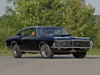 Black muscle car parked street - a black muscle car free wallpaper