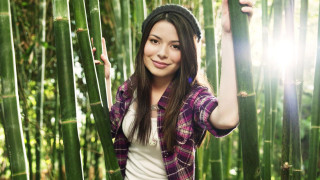 Woman bamboo tree arms up - jungle free wallpaper