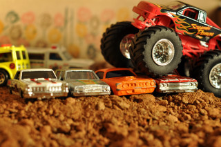 Toy truck toy cars dirt - a wall in the background free wallpaper