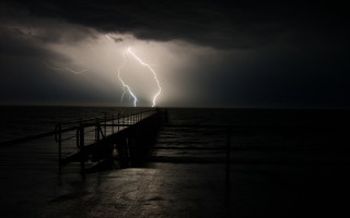 Lightning bolt pier night ocean - dramatic lightning free wallpaper