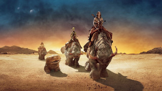 Elephants desert people riding dog 2 - weta digital free wallpaper