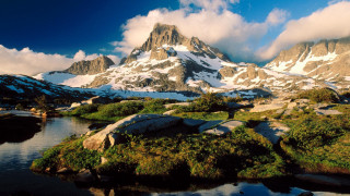 Mountain lake clouds snow capped - a lake in the foreground free wallpaper