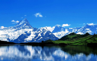 Mountain range reflection lake blue 4 - a mountain range in the background free wallpaper