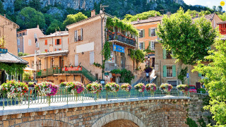 Bridge flowers building mountain trees - a building in the background free wallpaper for desktop