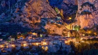 Village lit night mountainside town - a village free wallpaper