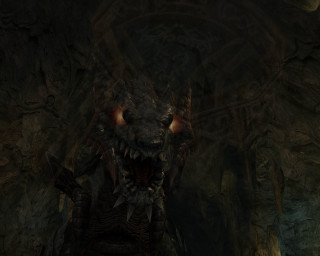 Demonic creature glowing eyes cave 2 - a stone wall free wallpaper