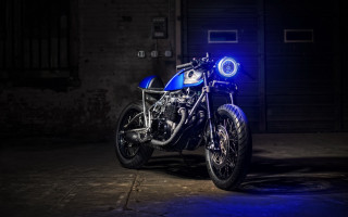 Blue motorcycle dark room wheelie - a blue light free wallpaper