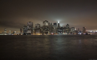 City skyline night foggy water - a city skyline free wallpaper for desktop