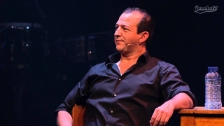 Man sitting table water bottle - his ear free wallpaper