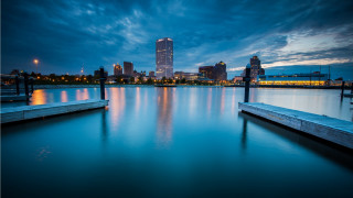 City skyline night lake dock - a dock in the foreground free wallpaper