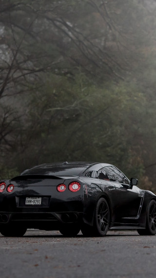 Black sports car foggy road - free cars wallpaper for mobile