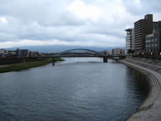 River bridge buildings people walking - asai chū free wallpaper