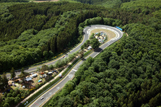 Winding road trees forest blue - aerial free wallpaper