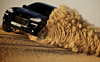 Black car desert sand explosion - dust free wallpaper
