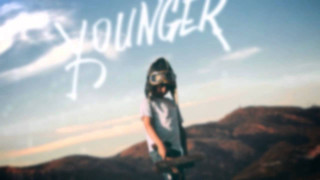 Young man skateboard mountain backdrop - a childs free wallpaper