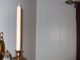 Candle lit wall mirror towel - a towel free wallpaper