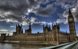 Large building clock tower cloudy 5 - a body of water below free wallpaper