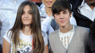 Two young boys standing crowd - brown hair free wallpaper