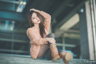 Woman sitting ground legs crossed 9 - a sweater free wallpaper