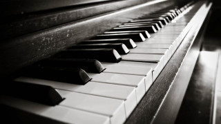 Piano closeup black white keys - cinematic composition free wallpaper
