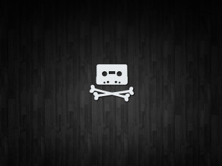 Skull crossbones black wood background - a white skull free wallpaper