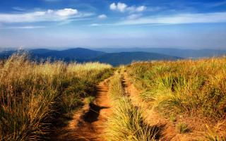Dirt path grassy field mountains - ada hill walker free wallpaper