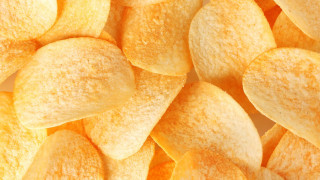 Yellow potato chips white surface 2 - a pile free wallpaper