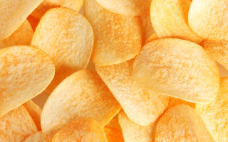Yellow potato chips white surface - a yellow border free wallpaper