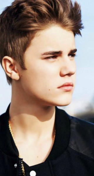 Young man spiked mohawk serious - his face and shoulders free wallpaper