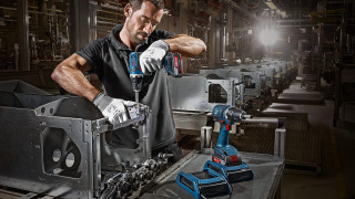 Man working machine factory spotlight - machine free wallpaper